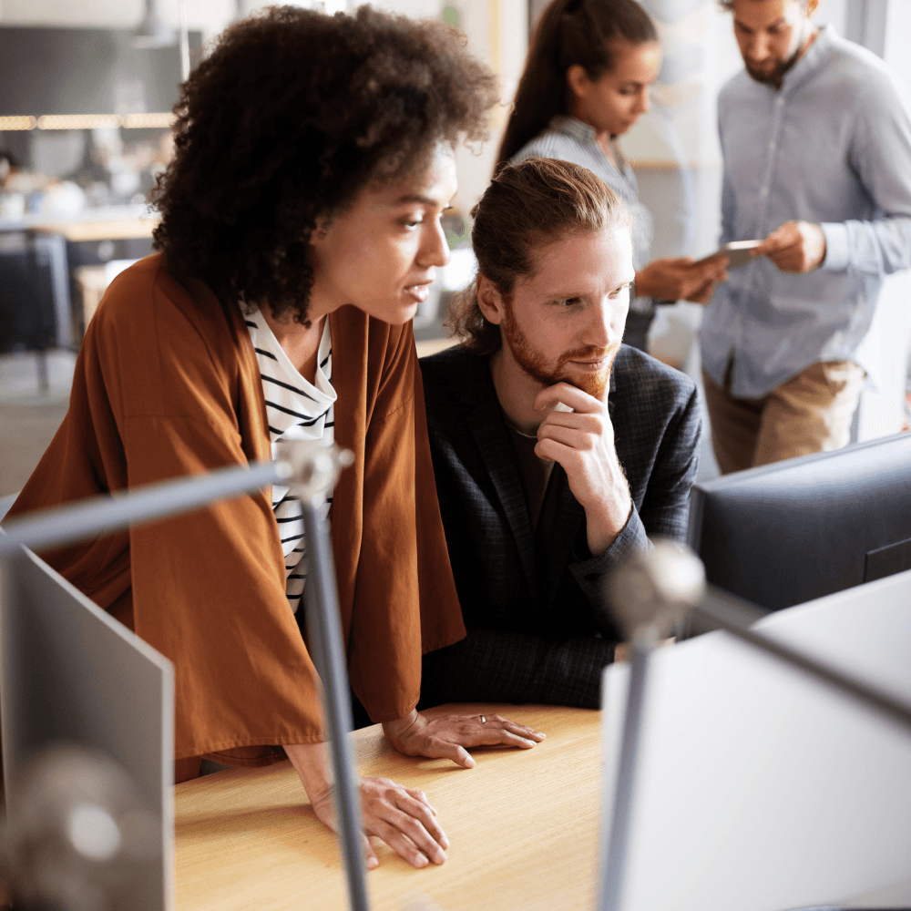 coworkers looking at computer