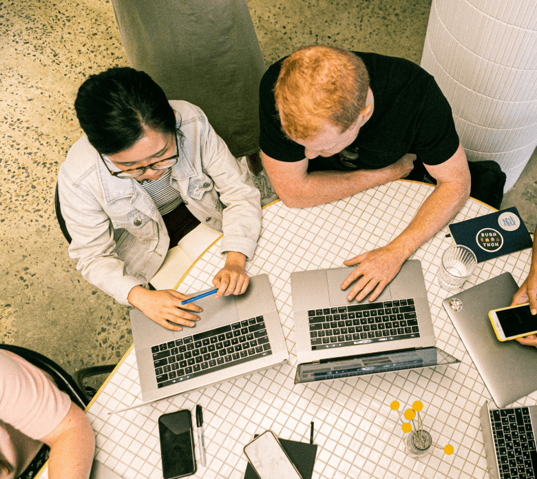 two people working on computers